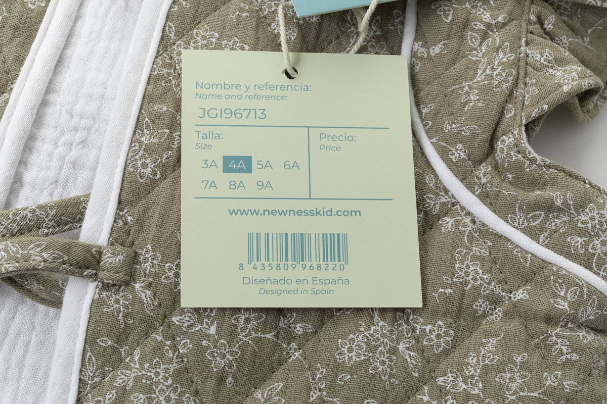 Gilet matelassé, volants aux épaules et nœud